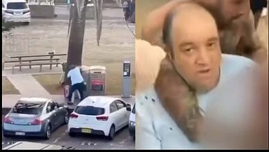 Ahmed Al Ahmed is helped by bystanders after chasing the shooter