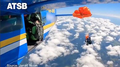 Australia skydiver's parachute stuck on plane