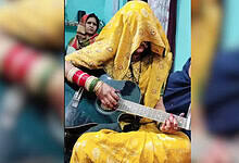 Ghunghat wearing newly married woman plays guitar, sparks debate