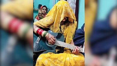 Ghunghat wearing newly married woman plays guitar, sparks debate