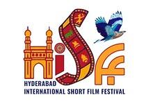 Hyderabad International Short Film Festival logo featuring Charminar monument, colorful film strip, blue bird in flight, and HISFF text