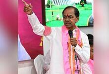 K. Chandrashekar Rao (KCR), BRS party leader, speaking at a public event in Telangana with pink party branding visible in the background