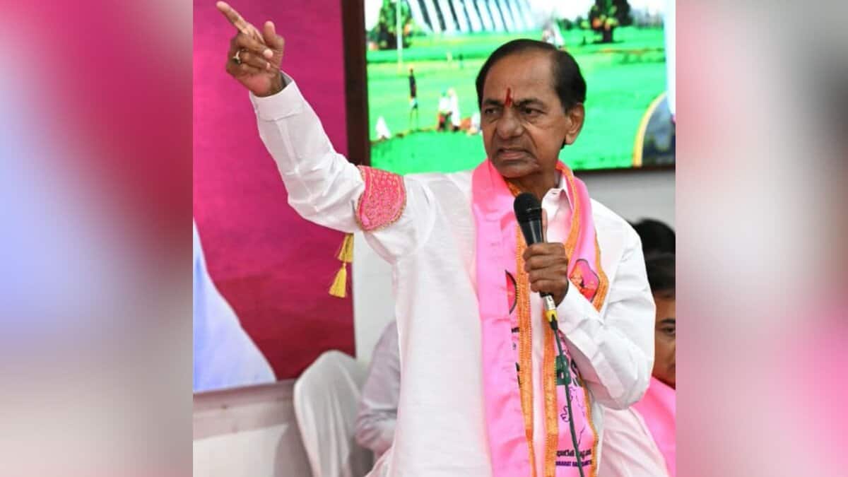 K. Chandrashekar Rao (KCR), BRS party leader, speaking at a public event in Telangana with pink party branding visible in the background