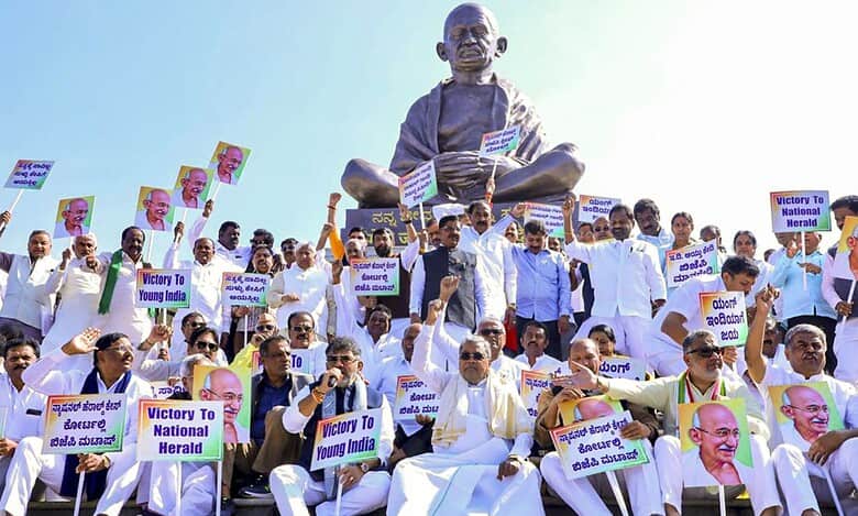 Karnataka Chief Minister Siddaramaiah with Deputy CM DK Shivakumar and other Congress leaders stage a protest against the Centre's move to replace the existing rural employment law MGNREGA in Belagavi on Wednesday. (PTI Photo)