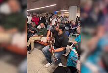 Mumbai man plays guitar after flights cancelled