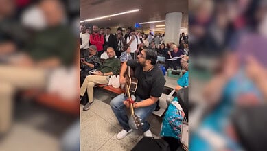 Mumbai man plays guitar after flights cancelled