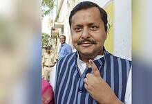Bihar cabinet minister Nitin Nabin showing his inked finger after casting vote at a polling station