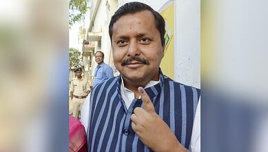 Bihar cabinet minister Nitin Nabin showing his inked finger after casting vote at a polling station