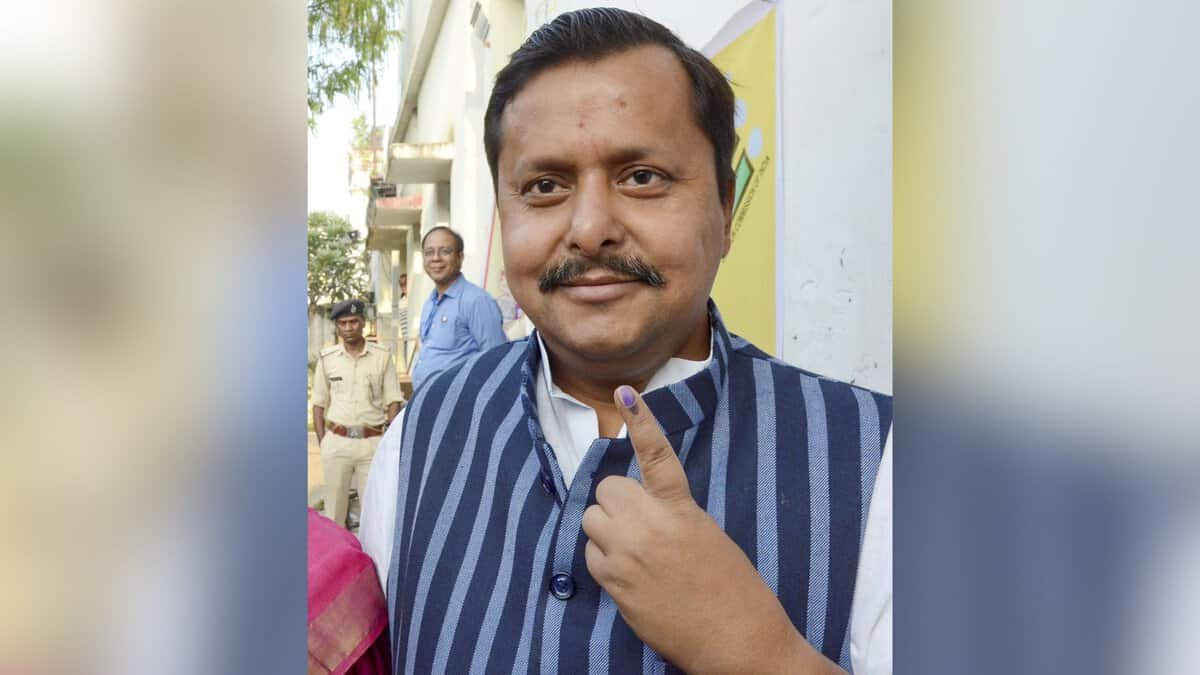 Bihar cabinet minister Nitin Nabin showing his inked finger after casting vote at a polling station