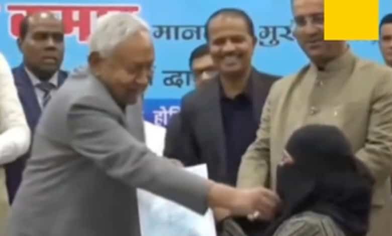 Nitish Kumar pulls woman's niqab during gathering