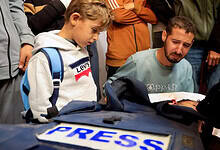 People mourn freelance Palestinian journalist Mahmoud Wadi at Nasser hospital, killed by an Israeli strike on Dec. 2, 2025, in Khan Younis, in the southern Gaza Strip.