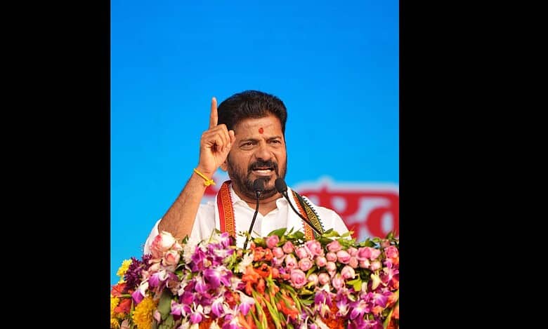 Telangana CM Revanth Reddy addresses a meeting in Warangal