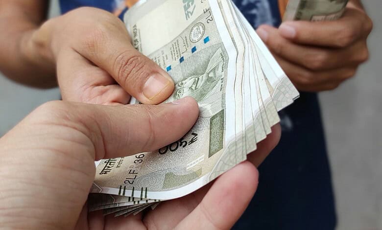 An officer taking a bribe.