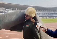 Man carries carpet from stadium after abrupt end to match featuring Messi