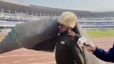 Man carries carpet from stadium after abrupt end to match featuring Messi