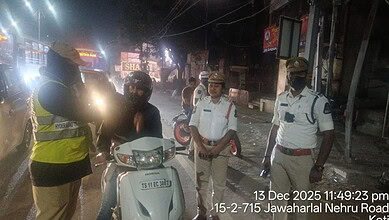 Police officials conduct a drunk driving check in Hyderabad'sKoti
