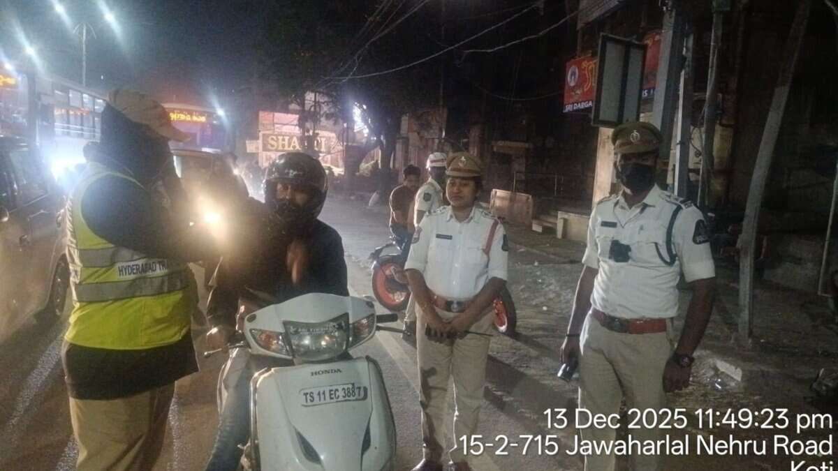 Police officials conduct a drunk driving check in Hyderabad'sKoti