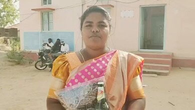 A woman returns beer and saree given by a losing candidate in Telangana