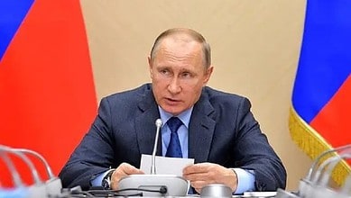 Russian President Vladimir Putin addresses a meeting