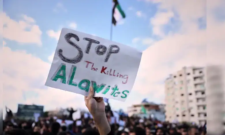 Protesters hold placards during Alawite demonstration in Latakia.