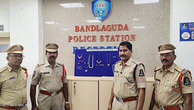 Image shows policemen standing in front of a board with gold and silver ornaments pinned on it