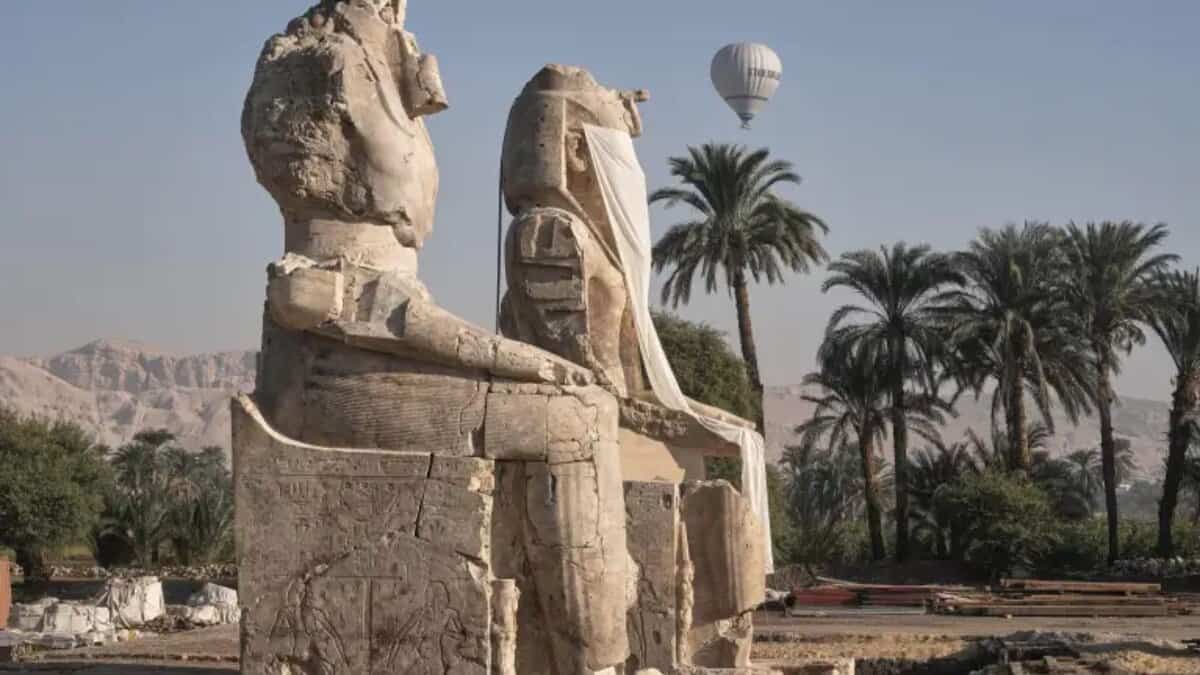 Two giant alabaster statutes for Pharoah Amenhotep III, before the official opening, in the southern city of Luxor, Egypt, Sunday, December 14. (Image: Associated Press/Amr Nabil)