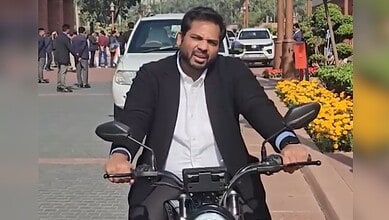 Congress MP representing Telangana's Peddapalli constituency, Gaddam Vamsi Krishna drives an electric bike on his way to the Parliament to raise awareness about Delhi's rising air pollution.