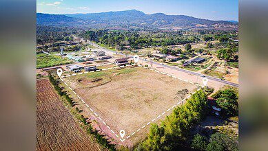 The image shows a patch of land surrounded by hills