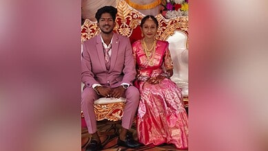 Image shows a couple at their wedding.