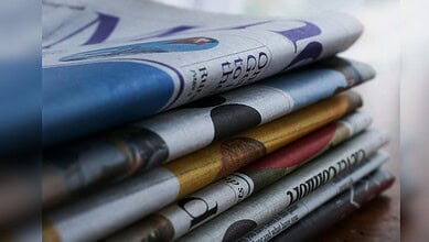 Image showing stacked newspapers