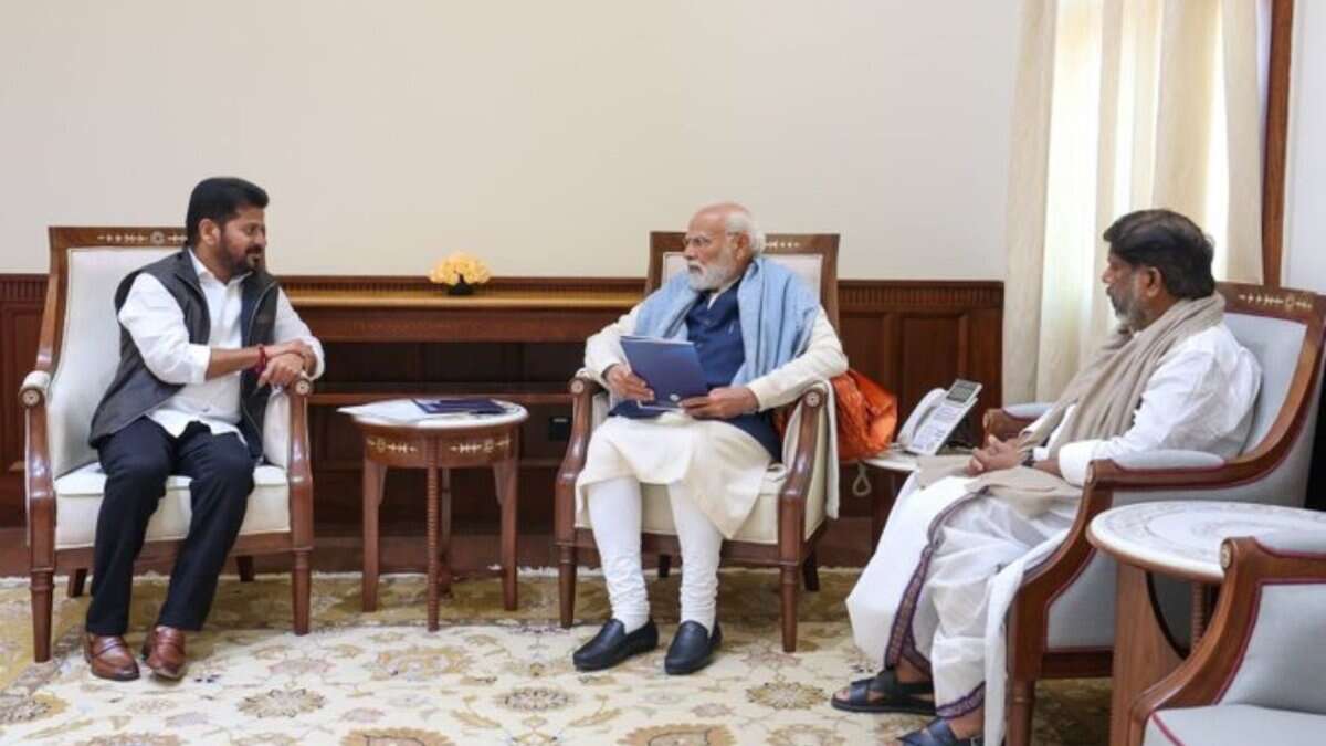 Image shows Telangana CM Revanth Reddy with Prime Minister Modi and Deputy CM Bhatti