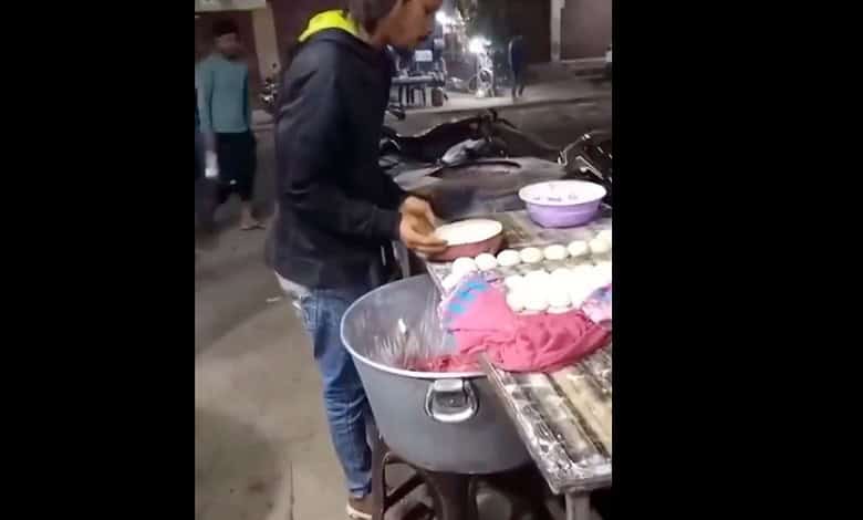 cook spitting on dough