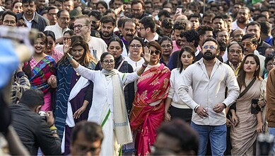 West Bengal Chief Minister and Trinamool Congress (TMC) chief Mamata Banerjee leads a protest march accompanied by party leaders including June Maliah and Dev and others against the Enforcement Directorate