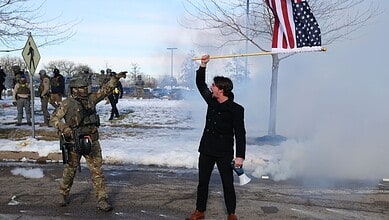 Protesters confront law enforcement outside the Bishop Henry Whipple Federal Building in Minneapolis