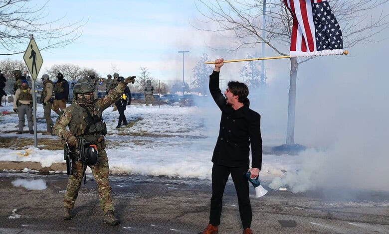 Protesters confront law enforcement outside the Bishop Henry Whipple Federal Building in Minneapolis