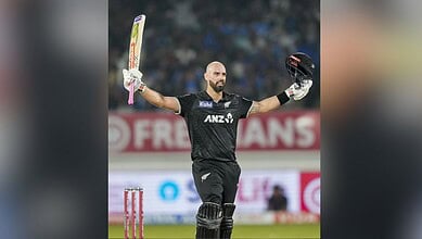 New Zealand's Daryl Mitchell celebrates his century during the second ODI cricket match between India and New Zealand at Niranjan Shah Stadium in Rajkot on Wednesday. (PTI Photo/Ravi Choudhary)