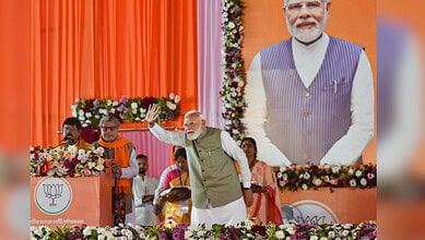 Hooghly: Prime Minister Narendra Modi waves to the gathering during a public meeting, at Singur, in Hooghly district, West Bengal, Sunday, Jan. 18, 2026. (PTI Photo)