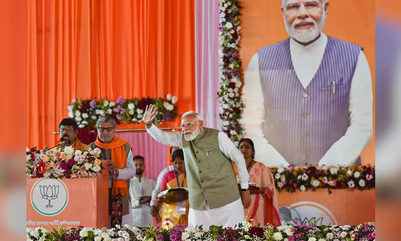Hooghly: Prime Minister Narendra Modi waves to the gathering during a public meeting, at Singur, in Hooghly district, West Bengal, Sunday, Jan. 18, 2026. (PTI Photo)