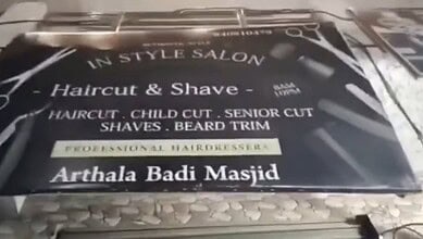 Image shows a sign board for a salon in Uttar Pradesh's Ghaziabad