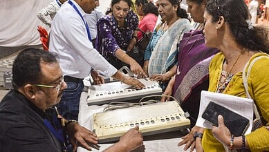 Polling officials take part in a training session on Electronic Voting Machines (EVMs) in Thane, Maharashtra.