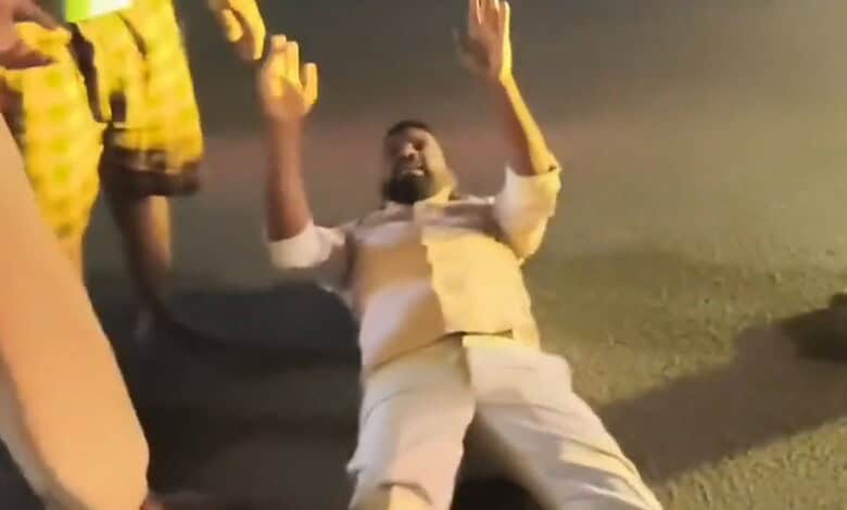 A man lies on the road in Hyderabad