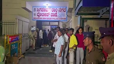 Devotees stand outside police station in Bengaluru