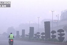 A man on his way to work amid poor AQI in Delhi
