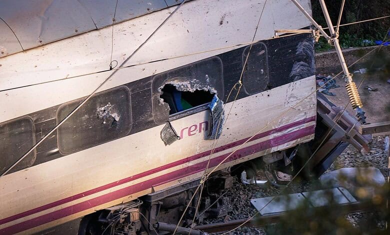 Part of a wrecked train is photographed at the site of a train collision in Adamuz, southern Spain, Monday, Jan. 19, 2026