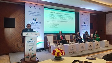 Telangana Chief Electoral Officer C Sudarshan Reddy speaking at the IICDEM - 2026 conference