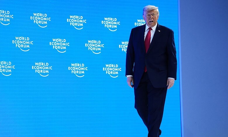 President Donald Trump arrives on stage to address the audience during the Annual Meeting of the World Economic Forum in Davos, Switzerland, Wednesday (AP)