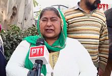 A woman speaks to the media after acquittal of 1984 riots accused Sajjan Kumar