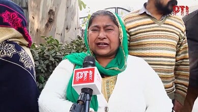 A woman speaks to the media after acquittal of 1984 riots accused Sajjan Kumar