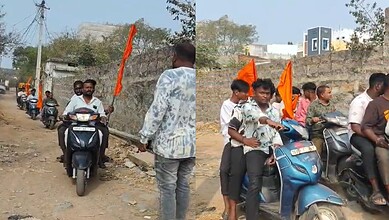 Participants of Dharma Raksha Sabha rally carrying saffron flags in Balapur