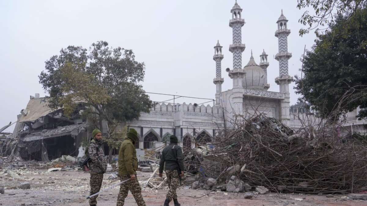 An excavator used in demolition of alleged encroachments stands amid rubble after the demolition of alleged encroachments on land adjoining the mosque, carried out by the Municipal Corporation of Delhi (MCD), in the Turkman Gate area of New Delhi, Thursday, Jan. 8, 2026.